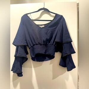 Likely navy ruffle crop top